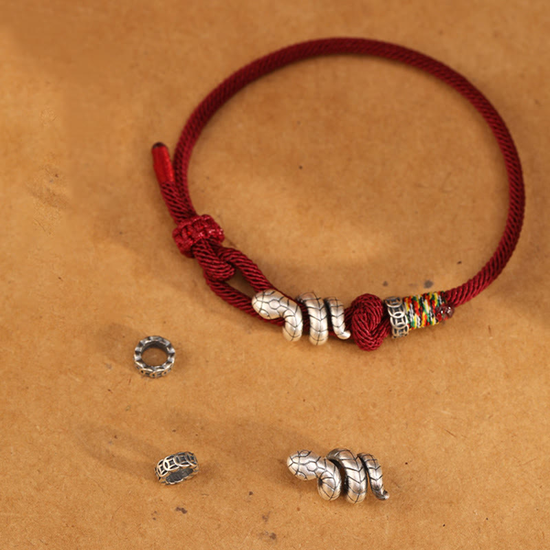 Bracelet en argent sterling rouge foncé 14-17 cm avec pièce de monnaie serpent et cordon rouge