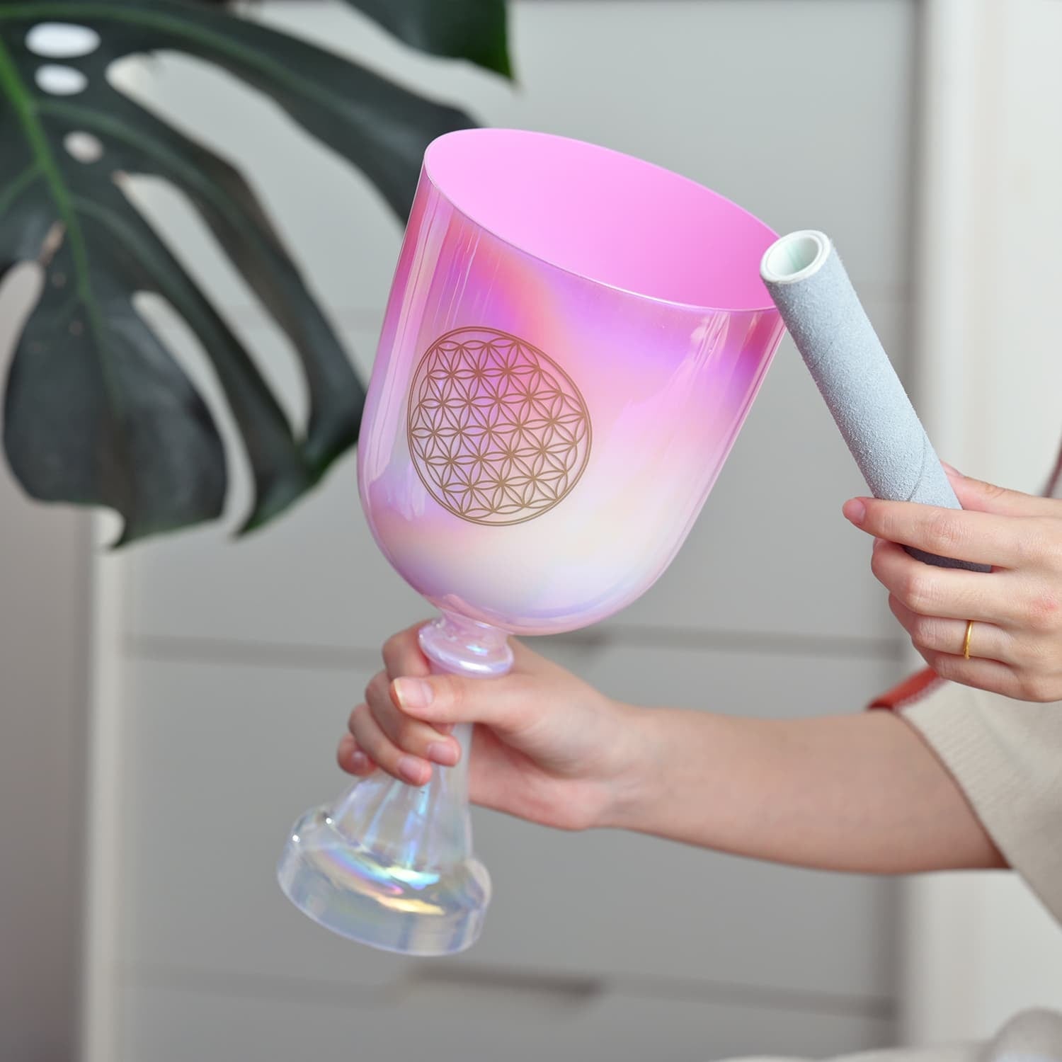 Pink iridescent wine glass with geometric flower pattern for sound healing