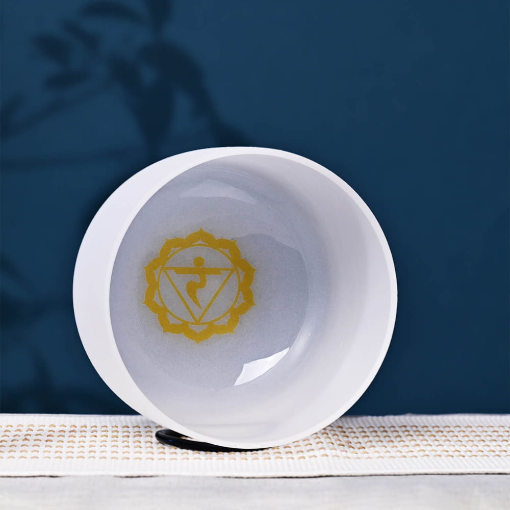 White ceramic bowl featuring yellow Solar Plexus Chakra symbol for meditation