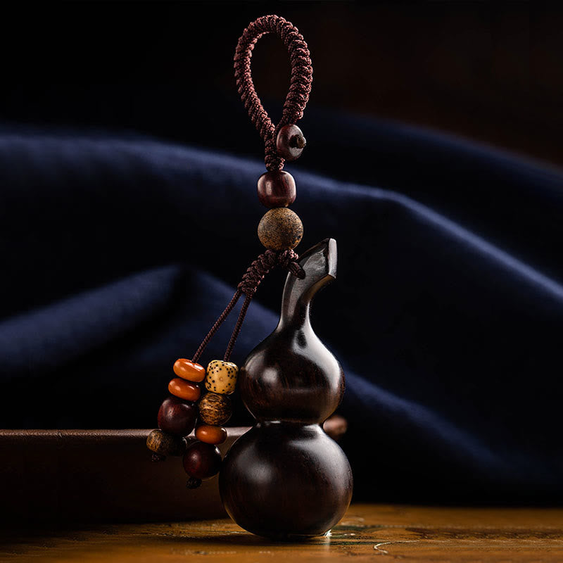 Porte-clés en ébène et gourde de santal rouge pour la chance et la protection