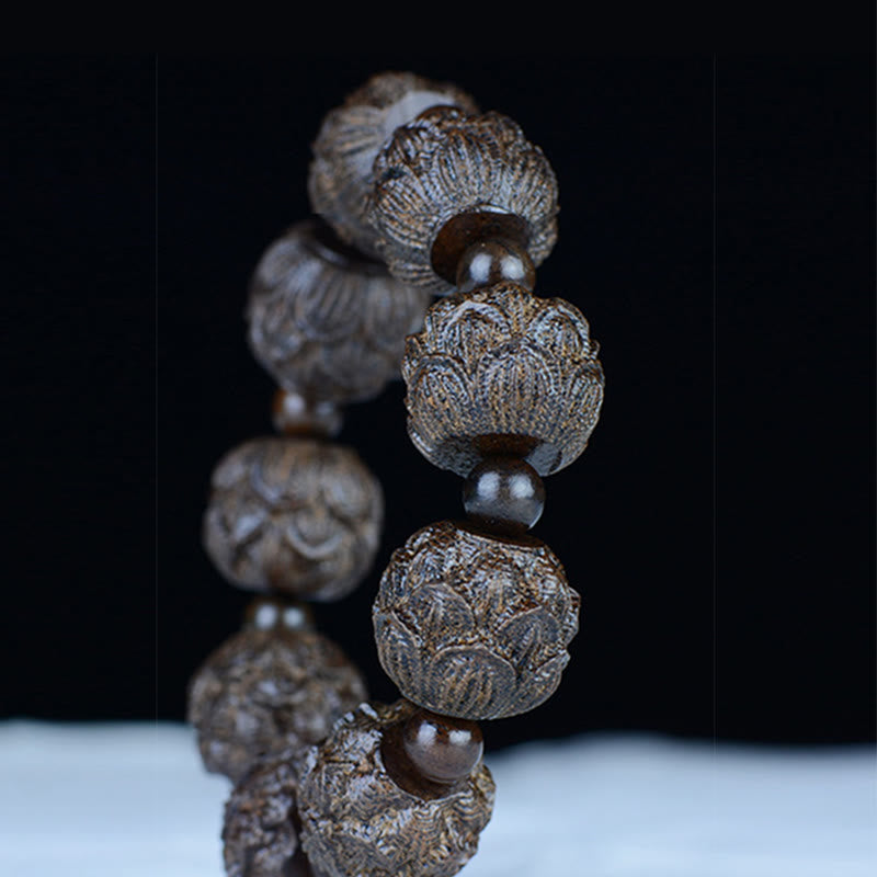 Bracelet d'équilibre en bois d'ébène avec dragon lotus et arhats