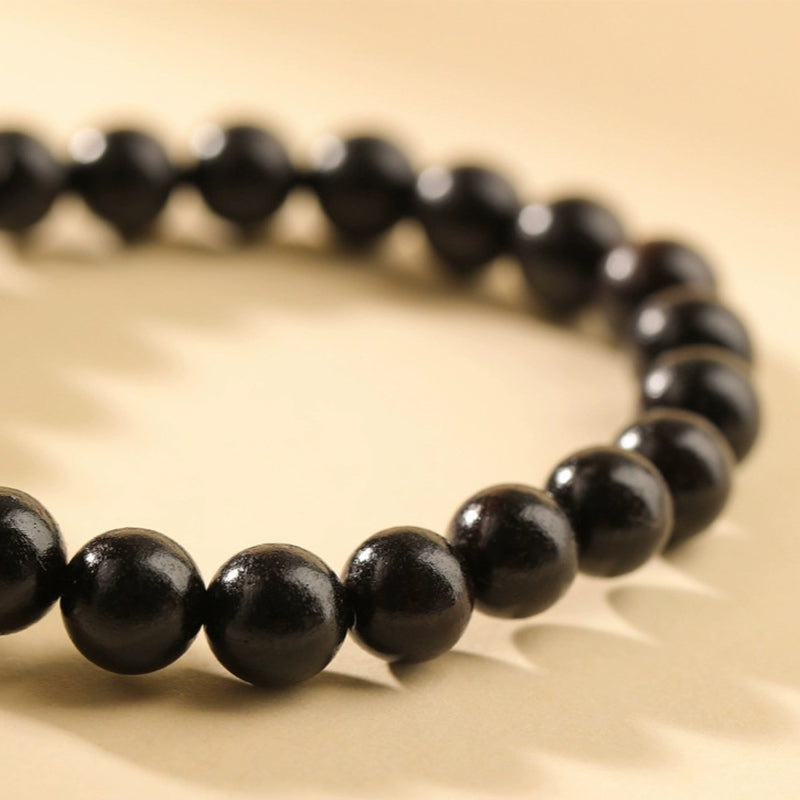 Bracelet tête de chat en bois d'ébène 8 mm pour la paix et l'équilibre