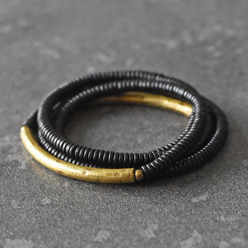 Bracelet multicouche en bois d'ébène et cuivre pour l'équilibre et le calme