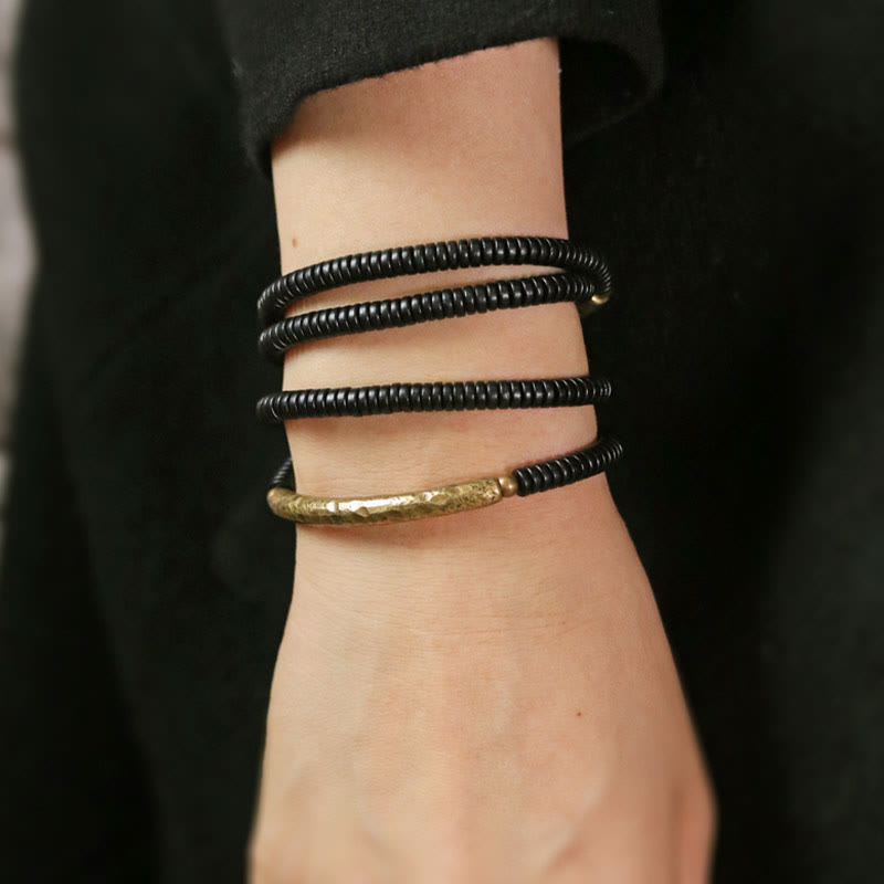 Bracelet multicouche en bois d'ébène et cuivre pour l'équilibre et le calme