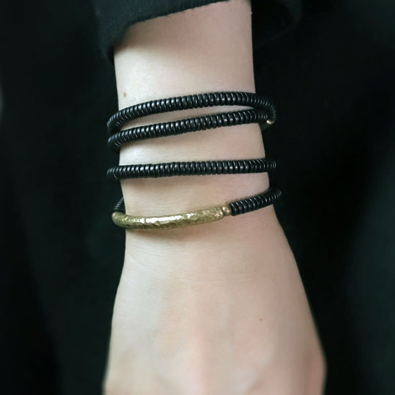 Bracelet multicouche en bois d'ébène et cuivre pour l'équilibre et le calme