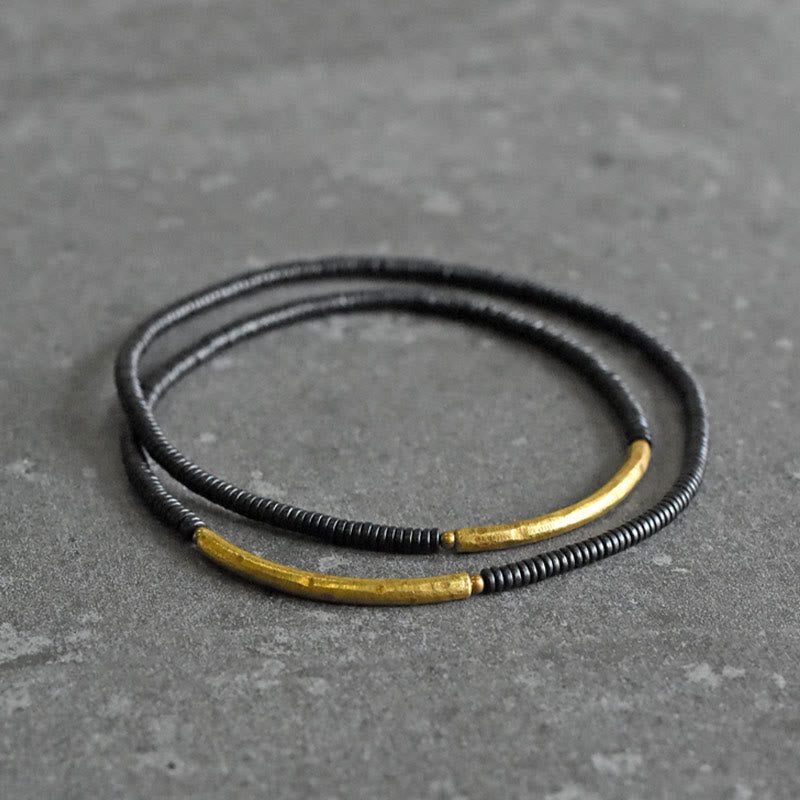 Bracelet multicouche en bois d'ébène et cuivre pour l'équilibre et le calme