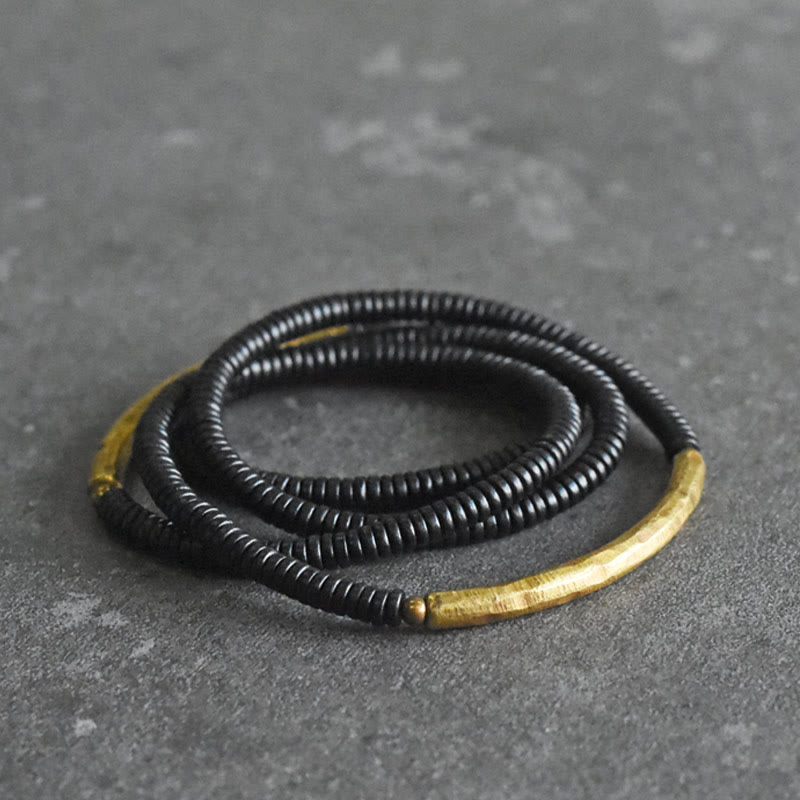 Bracelet multicouche en bois d'ébène et cuivre pour l'équilibre et le calme