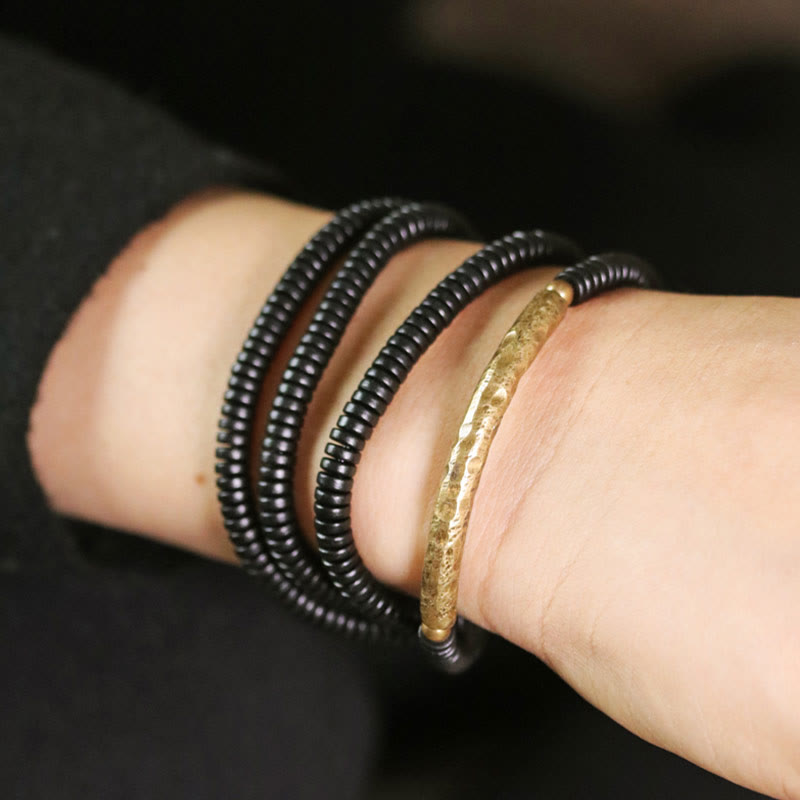 Bracelet multicouche en bois d'ébène et cuivre pour l'équilibre et le calme