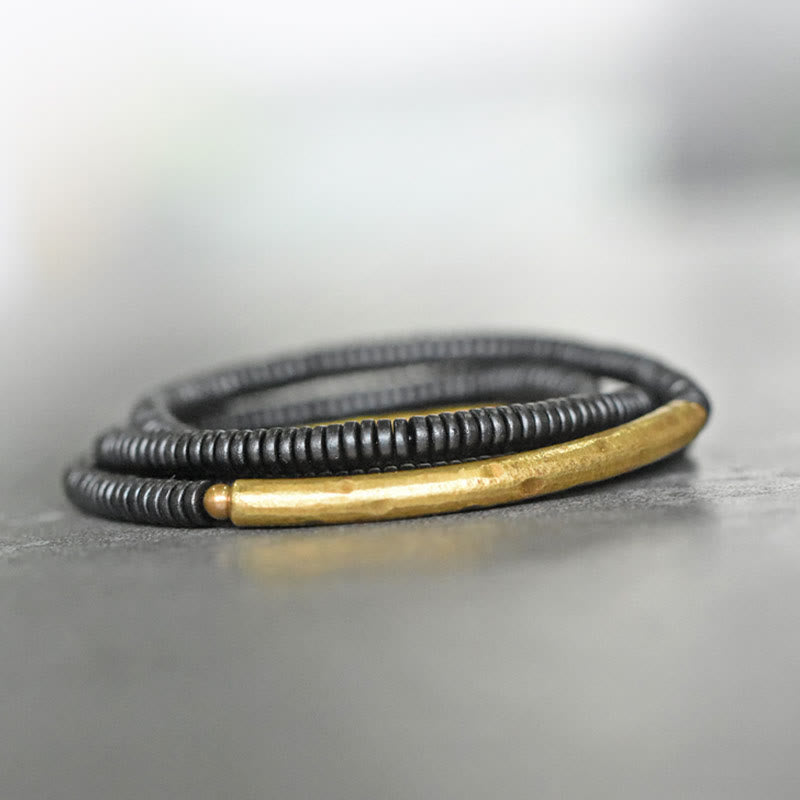 Bracelet multicouche en bois d'ébène et cuivre pour l'équilibre et le calme