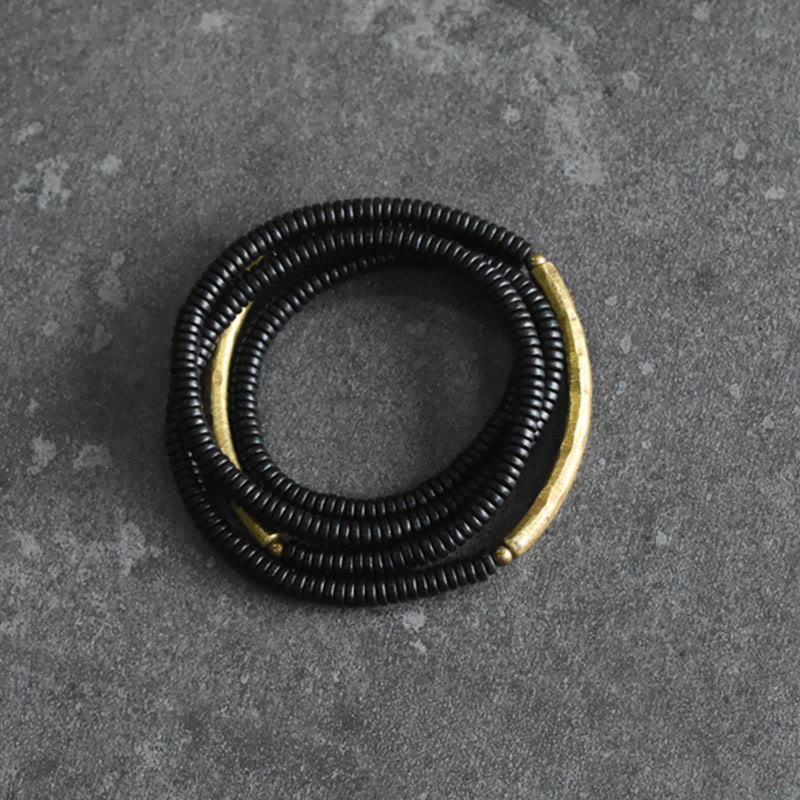 Bracelet multicouche en bois d'ébène et cuivre pour l'équilibre et le calme