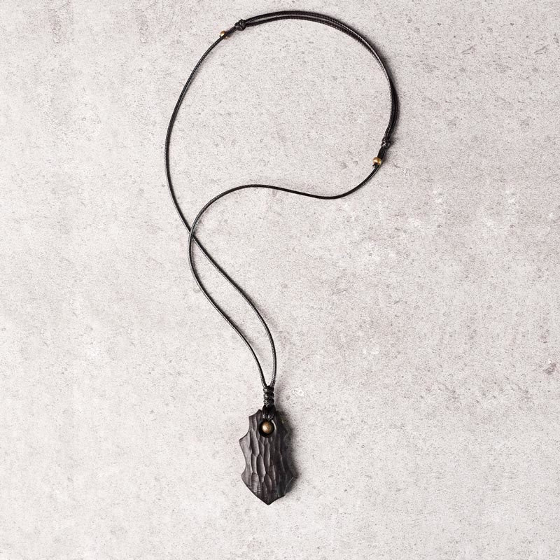 Collier spirituel en bois d'ébène et cuivre pour la paix et la protection