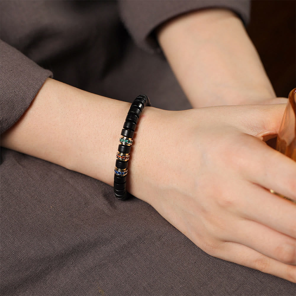 Bracelet Peace en bois d'ébène avec petite feuille de santal rouge et zircon, unisexe