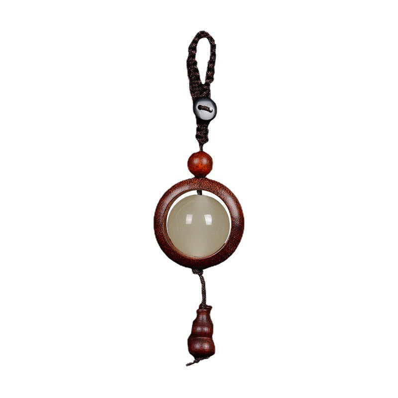 Porte-clés en bois d'ébène « Paix » | Perles lumineuses en bois de santal rouge et vert