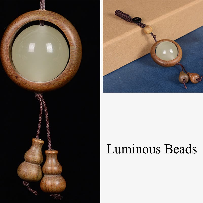 Porte-clés en bois d'ébène « Paix » | Perles lumineuses en bois de santal rouge et vert