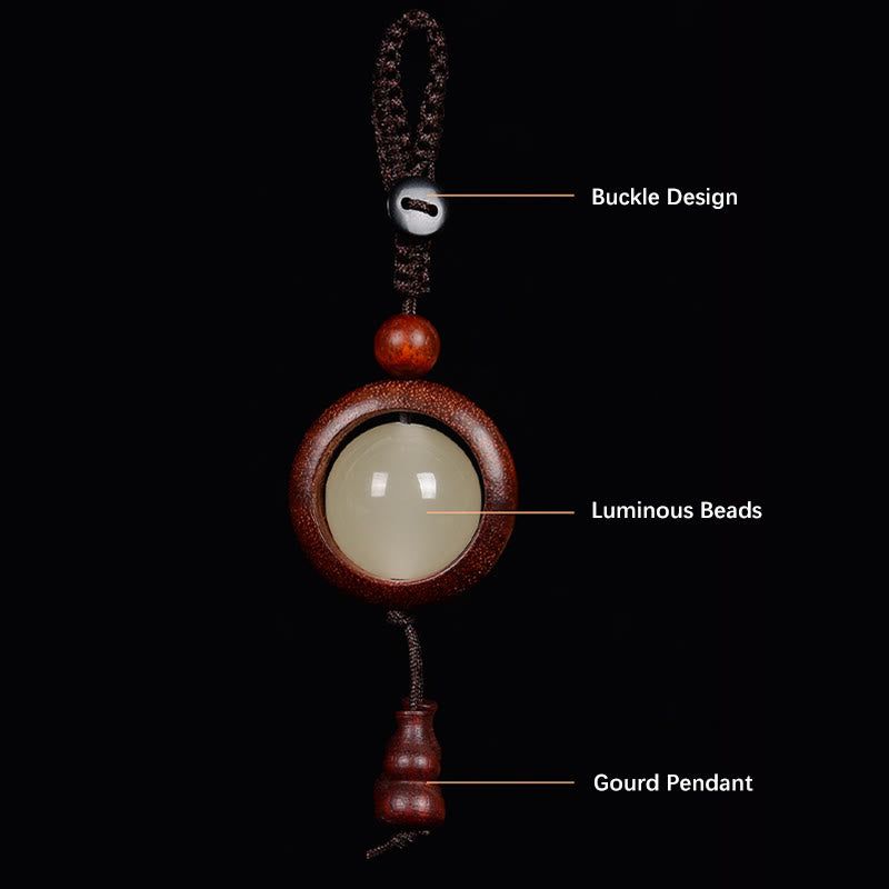 Porte-clés en bois d'ébène « Paix » | Perles lumineuses en bois de santal rouge et vert