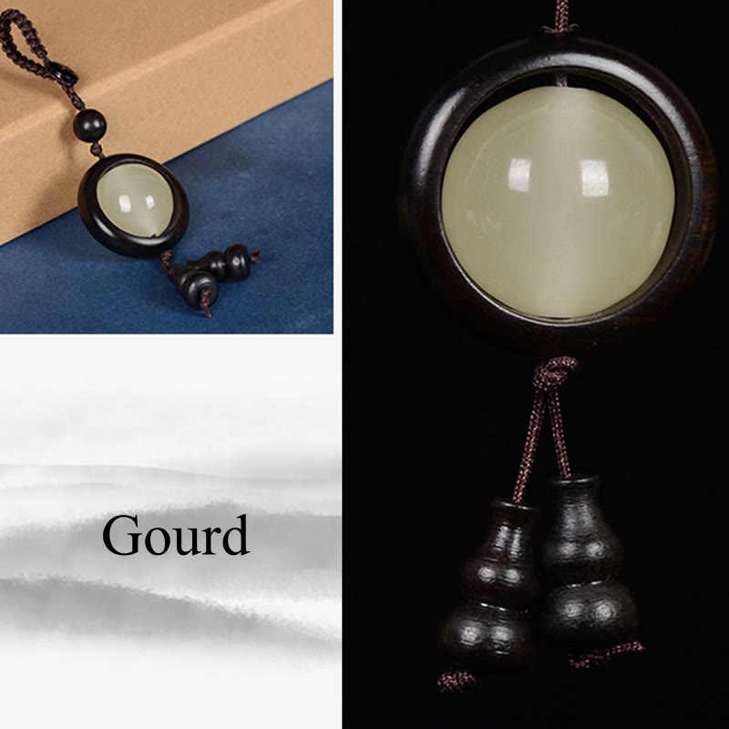 Porte-clés en bois d'ébène « Paix » | Perles lumineuses en bois de santal rouge et vert