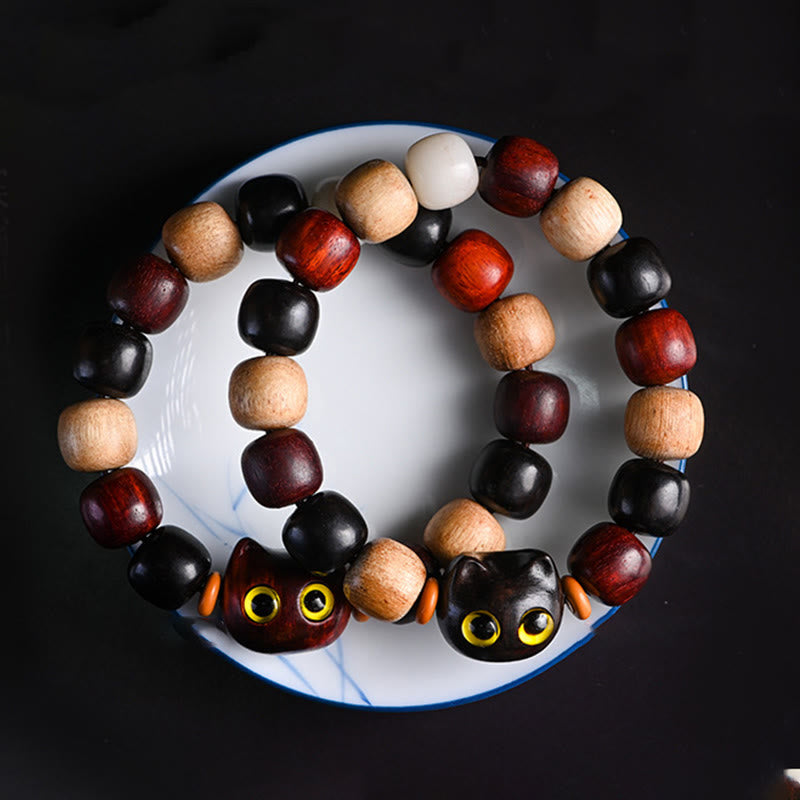 Bracelet de protection en bois d'ébène avec breloque chat en bois de santal rouge à petites feuilles