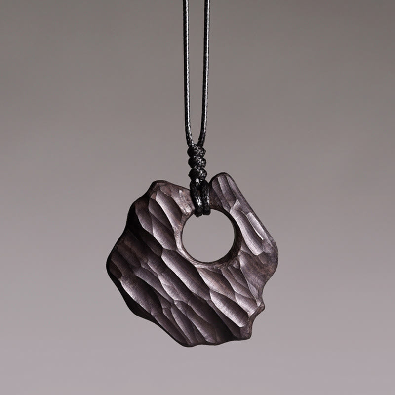 Collier spirituel en bois d'ébène avec pendentif d'équilibre creux