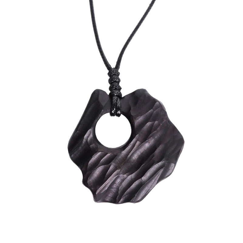Collier spirituel en bois d'ébène avec pendentif d'équilibre creux