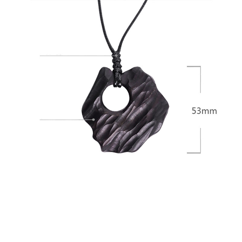 Collier spirituel en bois d'ébène avec pendentif d'équilibre creux