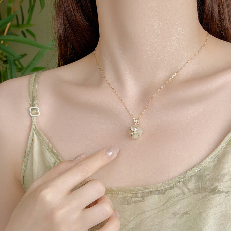Collier et boucles d'oreilles élégants en jade Hetian avec fleur de papillon