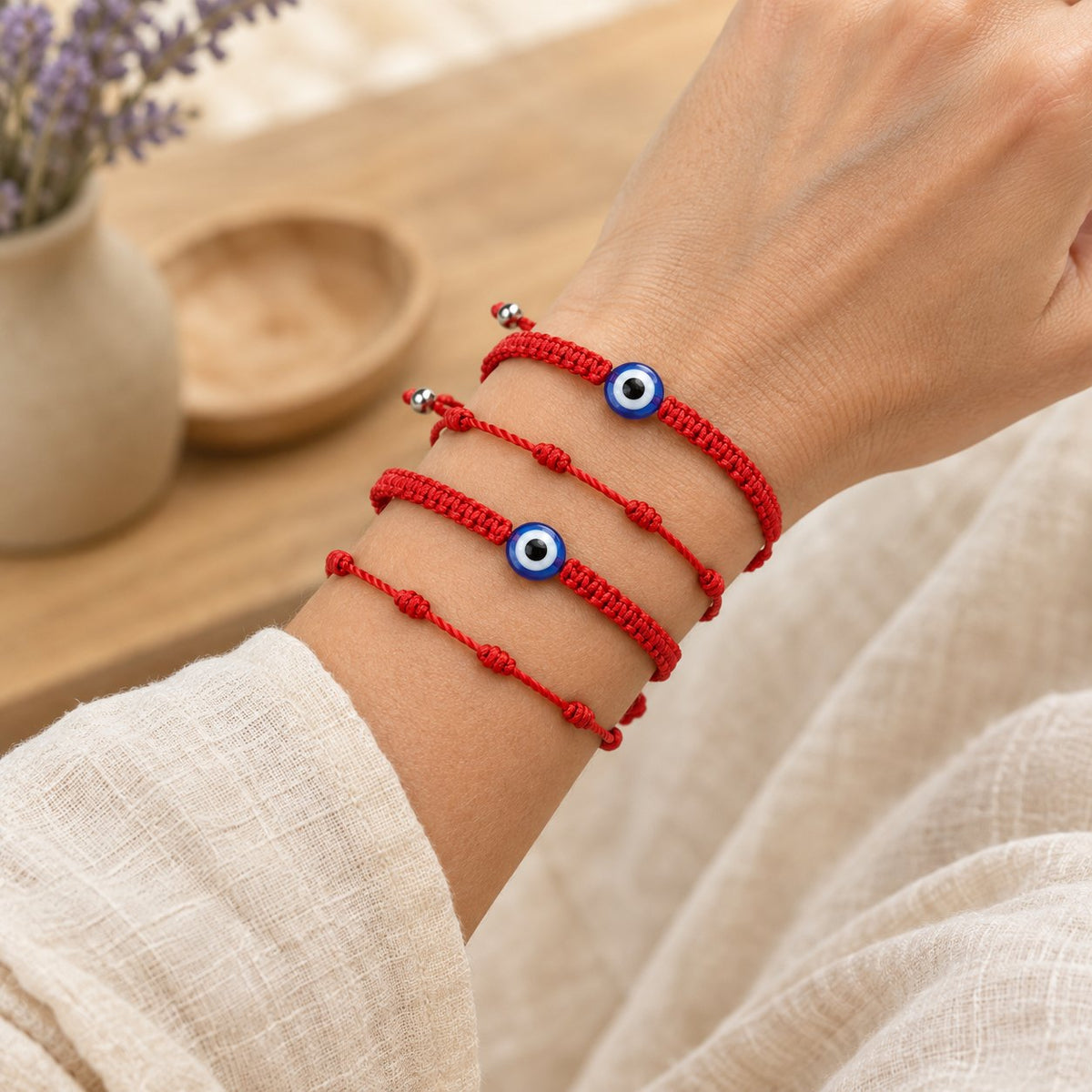 4Pcs Evil Eye Red String Protection Bracelet Set, worn on the wrist by a woman