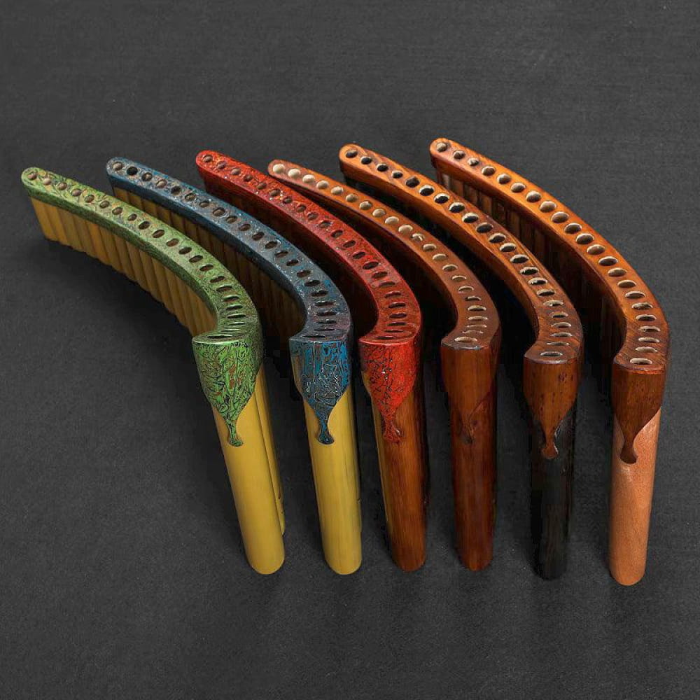 Colorful wooden boomerangs in a curved row for Expert Hand Painted Pan Flute