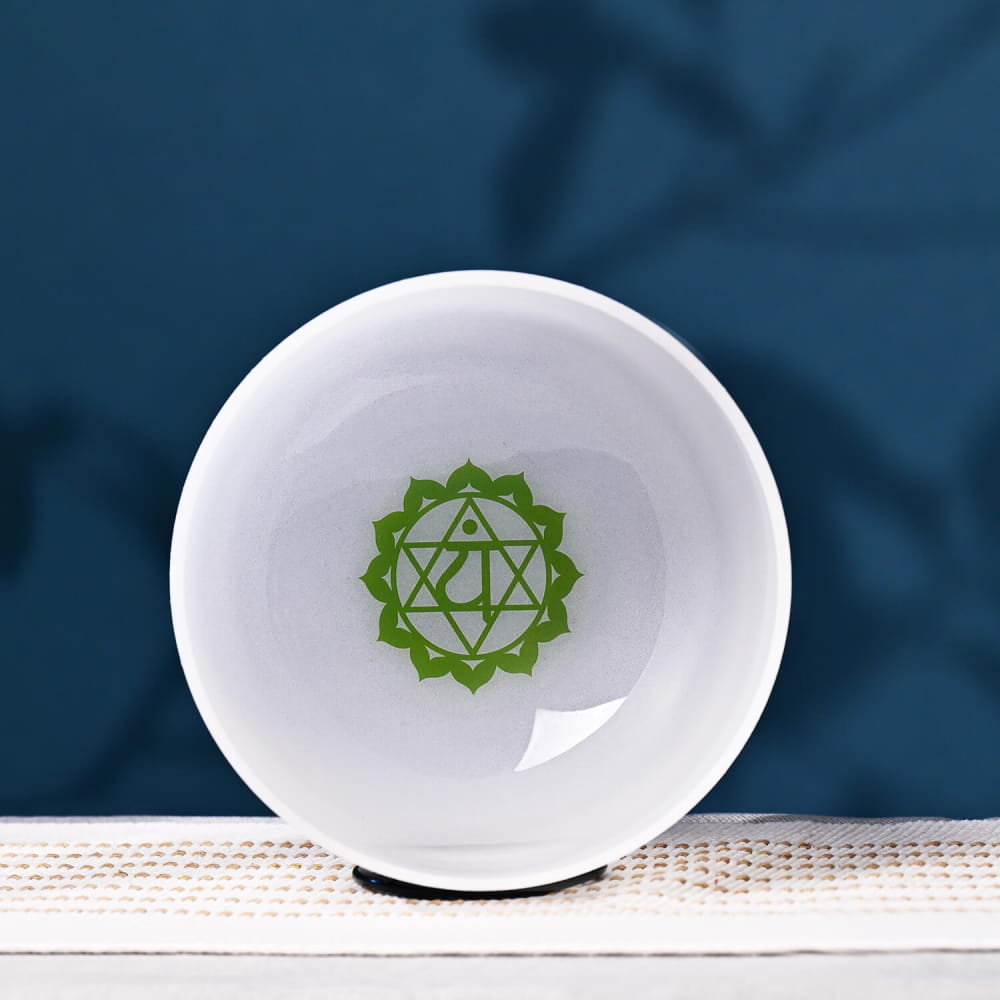 White ceramic bowl with green Heart Chakra symbol for meditation and healing