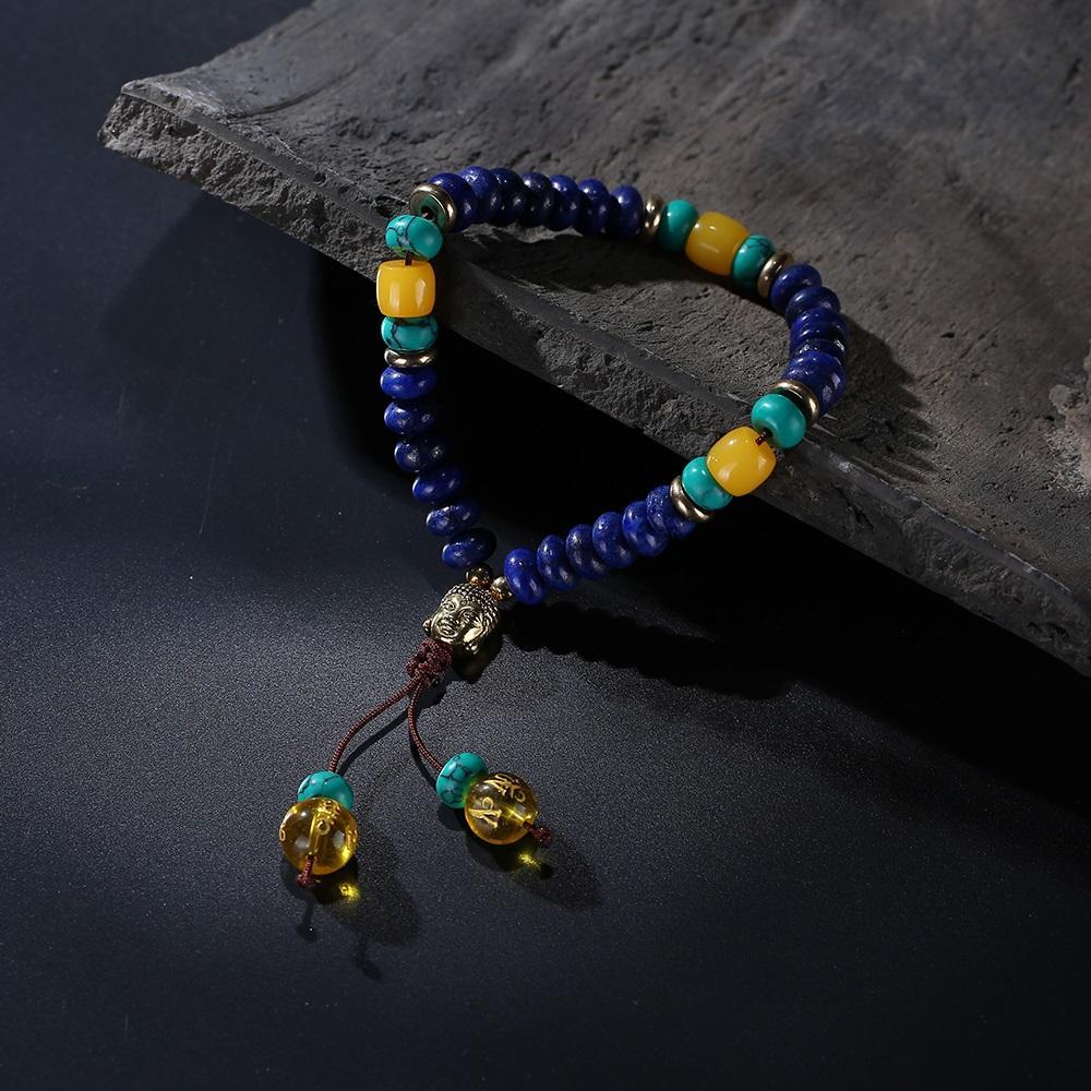 Bracelet Mala en pierre de lapis-lazuli naturelle plate avec pompon mantra à 6 syllabes et breloque tête de Bouddha