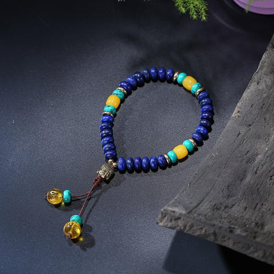 Bracelet Mala en pierre de lapis-lazuli naturelle plate avec pompon mantra à 6 syllabes et breloque tête de Bouddha