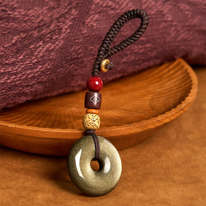 Porte-clés avec boucle de paix en obsidienne dorée pour la protection