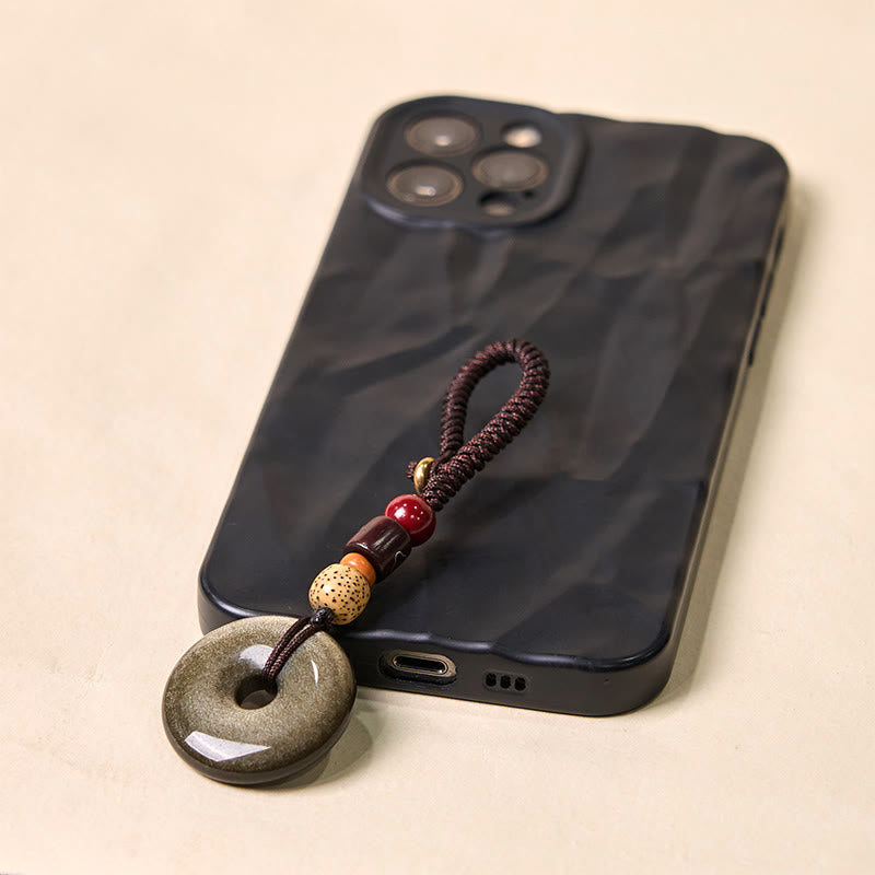 Porte-clés avec boucle de paix en obsidienne dorée pour la protection