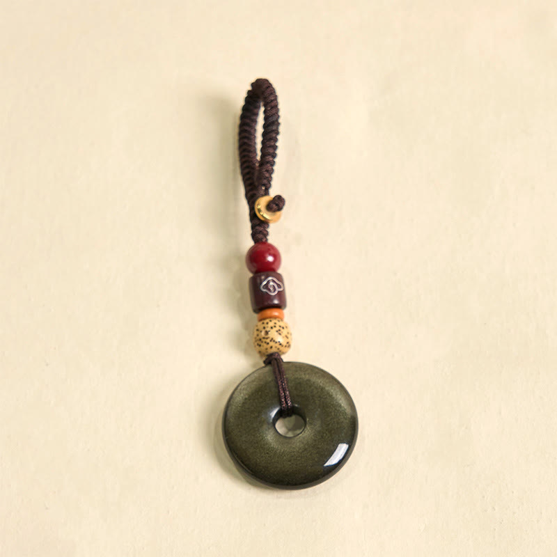 Porte-clés avec boucle de paix en obsidienne dorée pour la protection