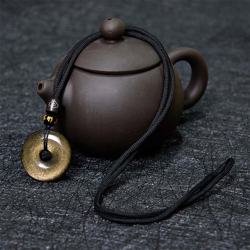 Collier avec pendentif en obsidienne dorée et boucle de paix