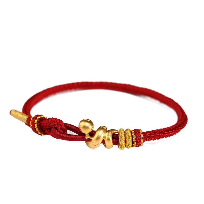 Bracelet serpent doré en fil rouge pour la force et la protection