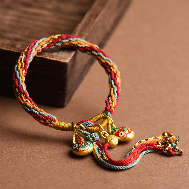 Bracelet porte-bonheur en or de la famille des Bêtes avaleuses | Cordon coloré