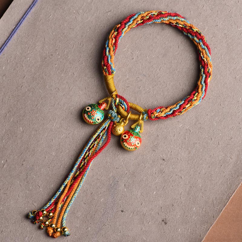 Bracelet porte-bonheur en or de la famille des Bêtes avaleuses | Cordon coloré
