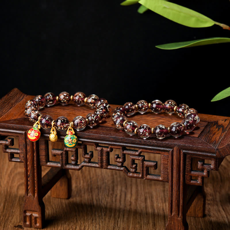 Bracelet en verre Liuli lumineux Bête avaleuse d'or 12 mm
