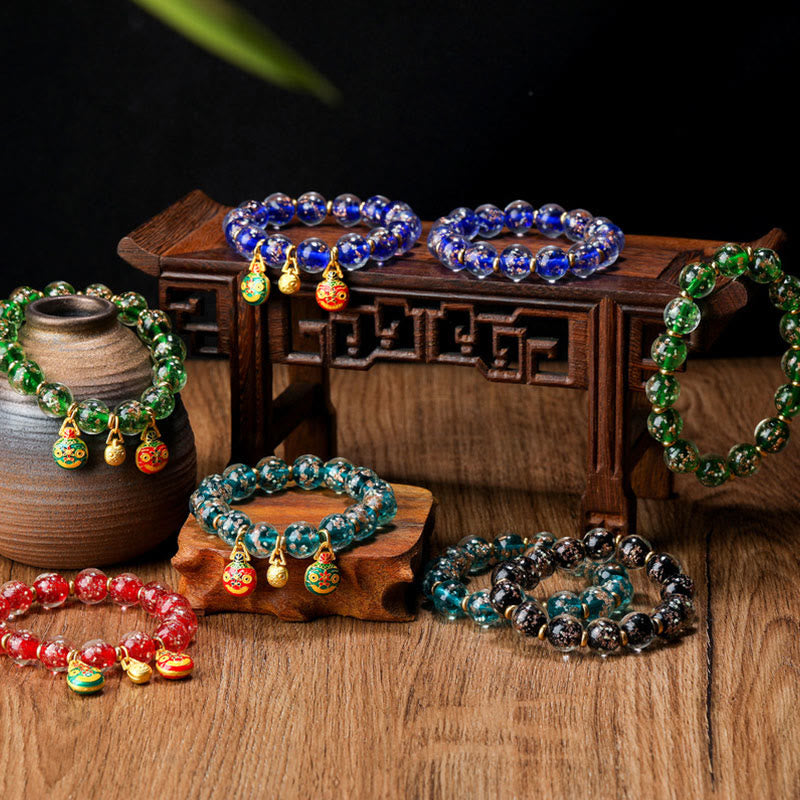 Bracelet en verre Liuli lumineux Bête avaleuse d'or 12 mm