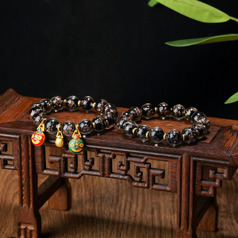 Bracelet en verre Liuli lumineux Bête avaleuse d'or 12 mm