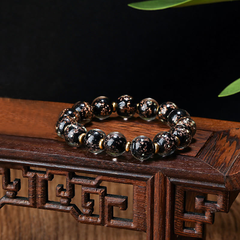 Bracelet en verre Liuli lumineux Bête avaleuse d'or 12 mm