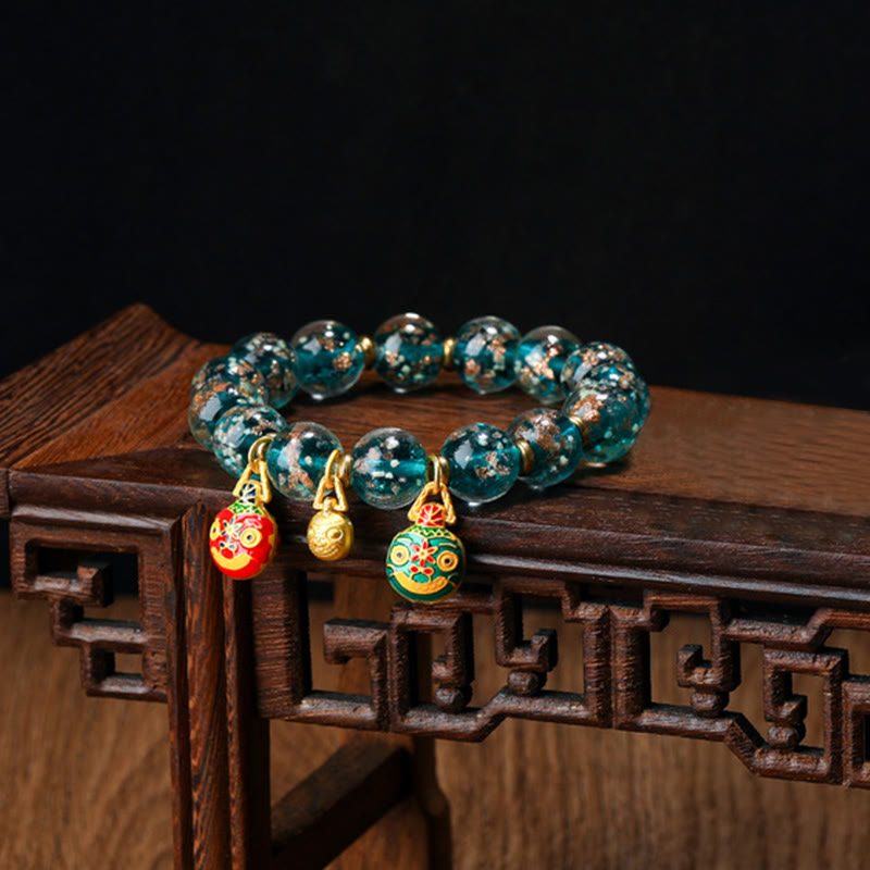 Bracelet en verre Liuli lumineux Bête avaleuse d'or 12 mm