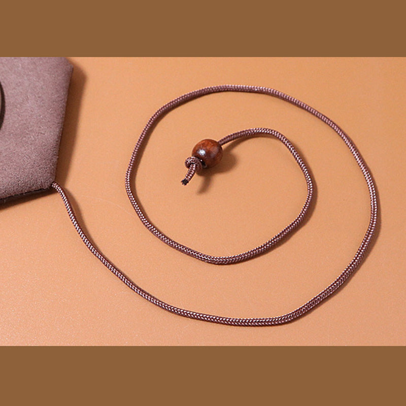 Coffret à bijoux zen doré à motif plumes