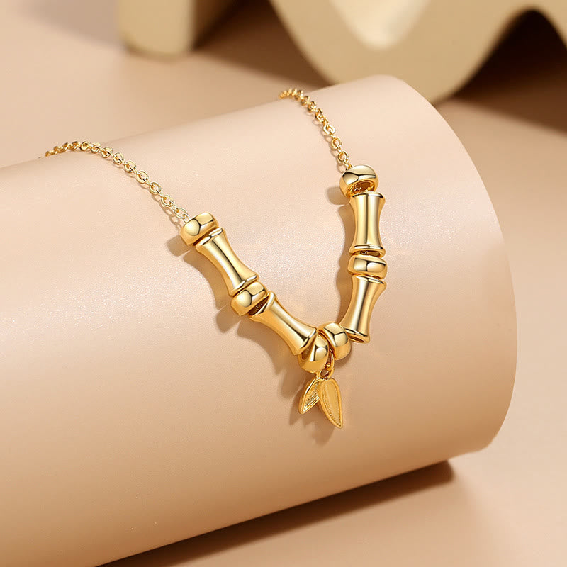 Collier spirituel en acier titane à motif bambou doré pour la richesse