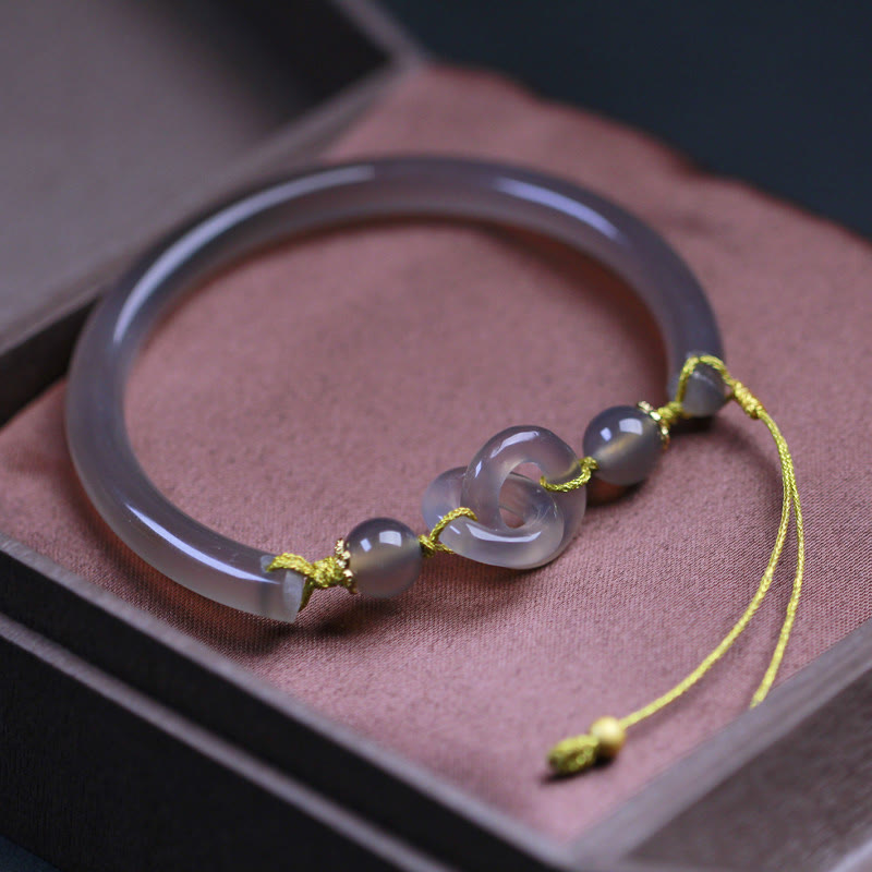 Bracelet spirituel en agate grise avec boucle de paix pour l'équilibre