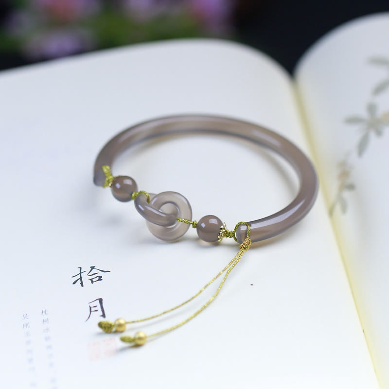 Bracelet spirituel en agate grise avec boucle de paix pour l'équilibre