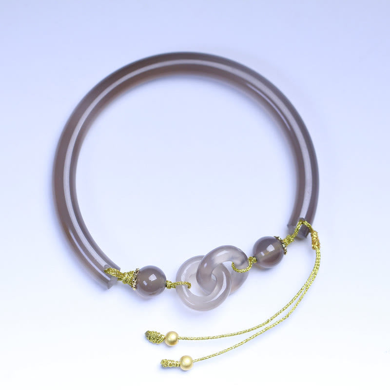 Bracelet spirituel en agate grise avec boucle de paix pour l'équilibre
