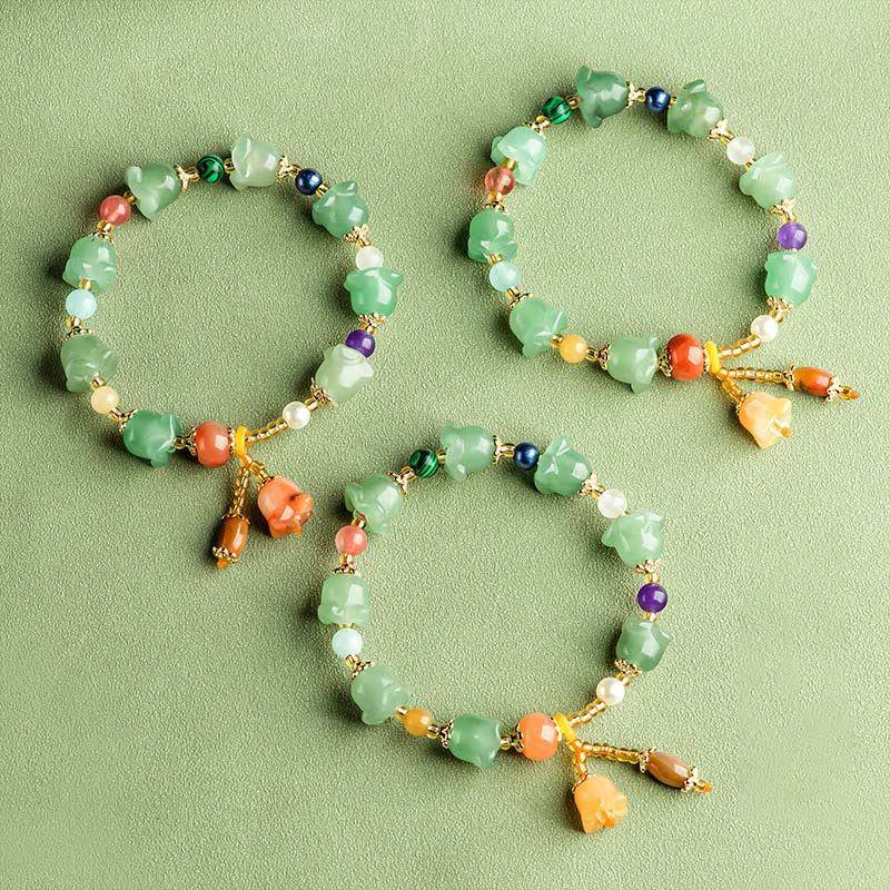 Bracelet porte-bonheur en aventurine verte et fleur de magnolia