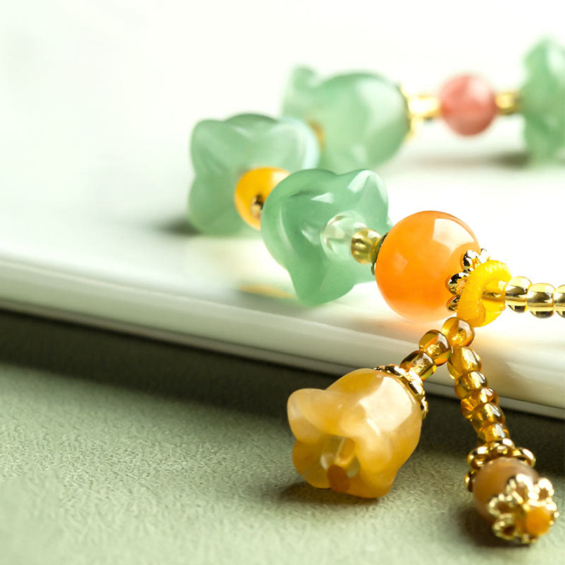 Bracelet porte-bonheur en aventurine verte et fleur de magnolia