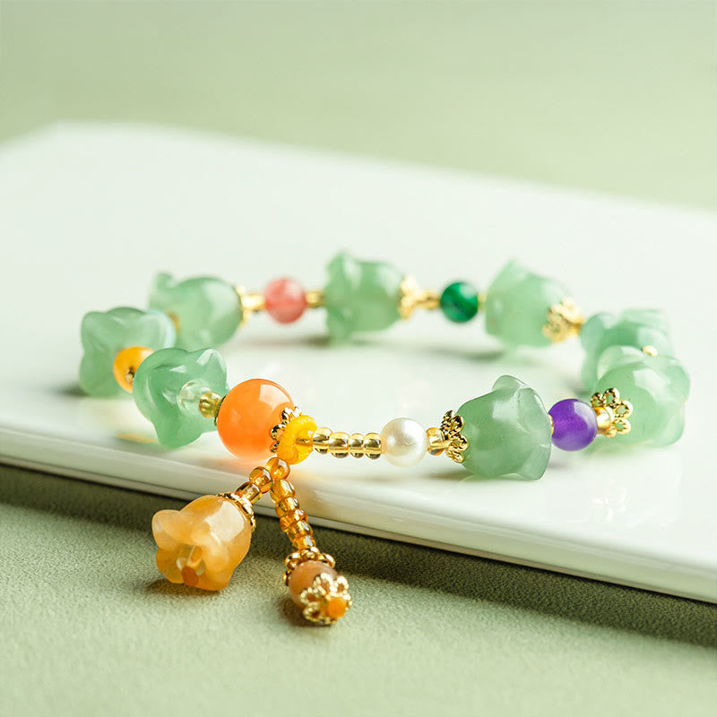 Bracelet porte-bonheur en aventurine verte et fleur de magnolia